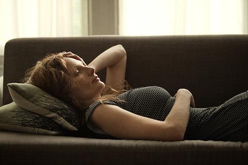 Woman Lying on Couch